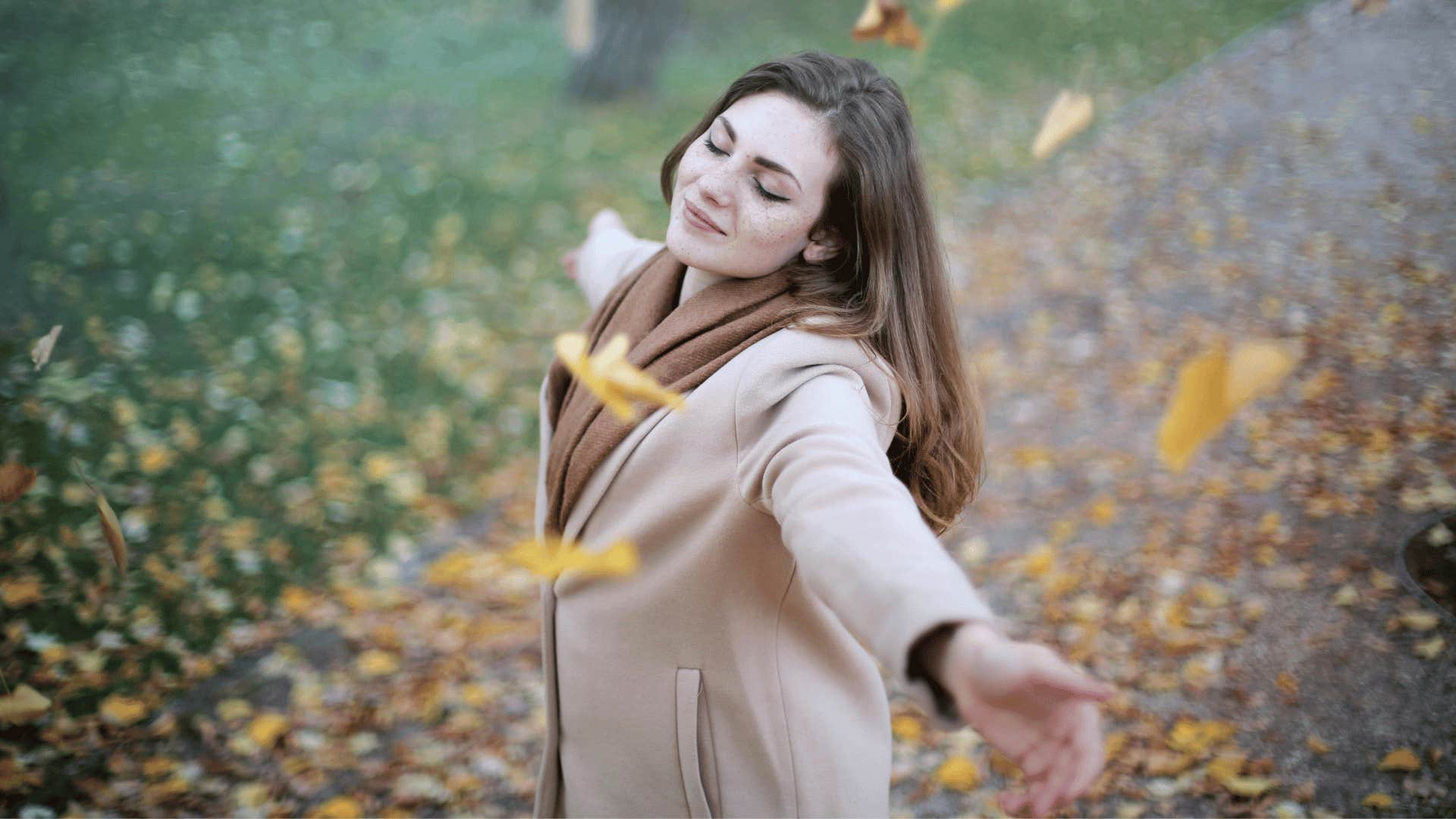 young woman enjoying the fall weather