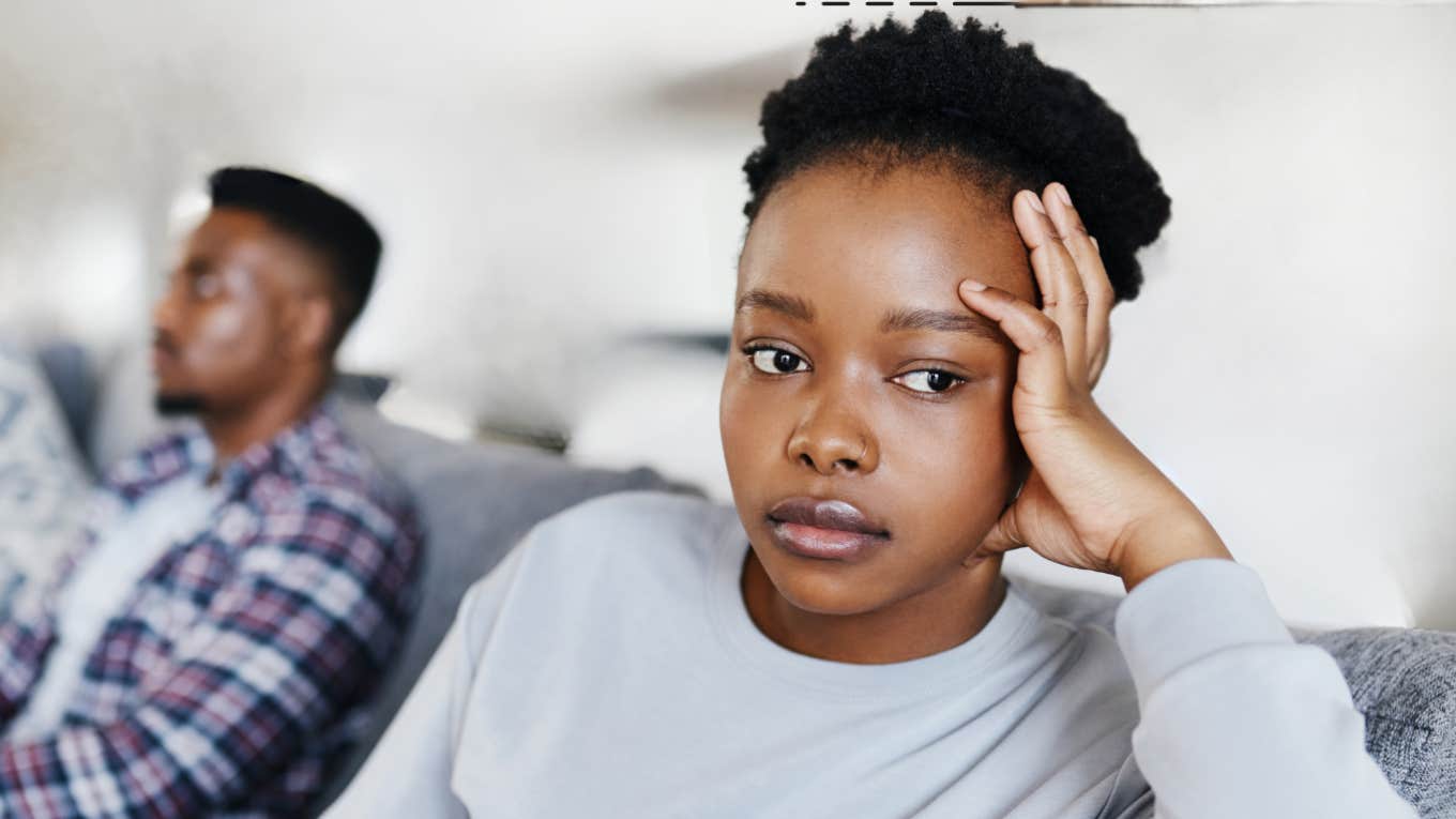 Couple on couch with subtle signs of marriage ending