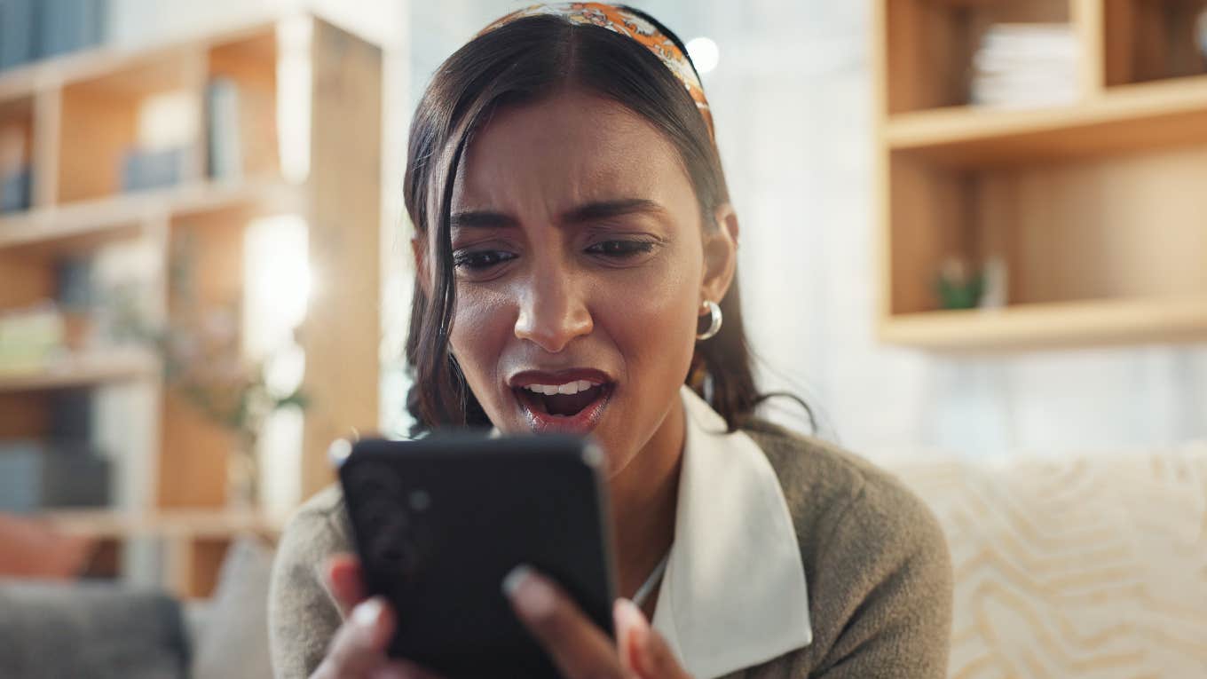 shocked woman looking at phone 