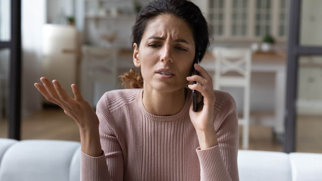 upset woman talking on the phone