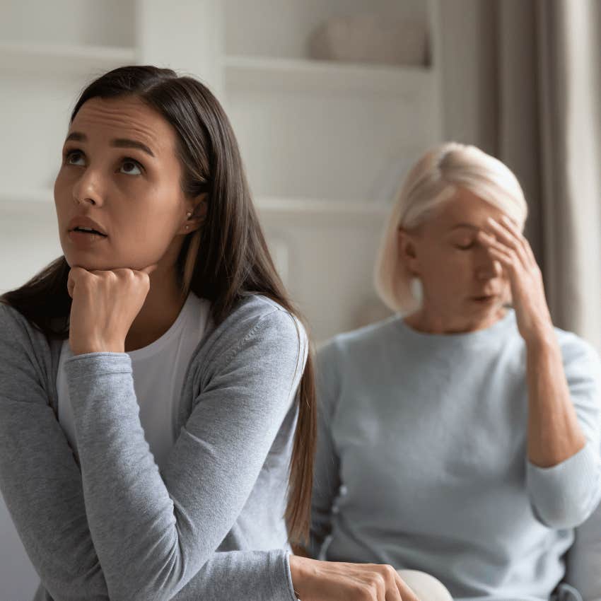 annoyed young woman in front of older woman