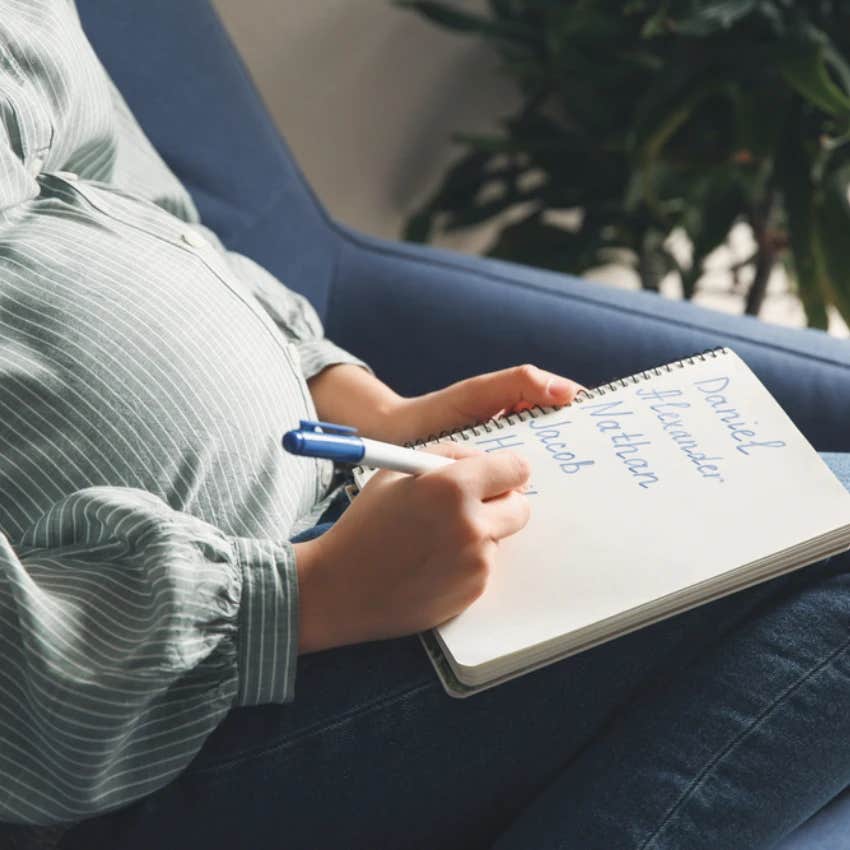 Woman writing a baby name list