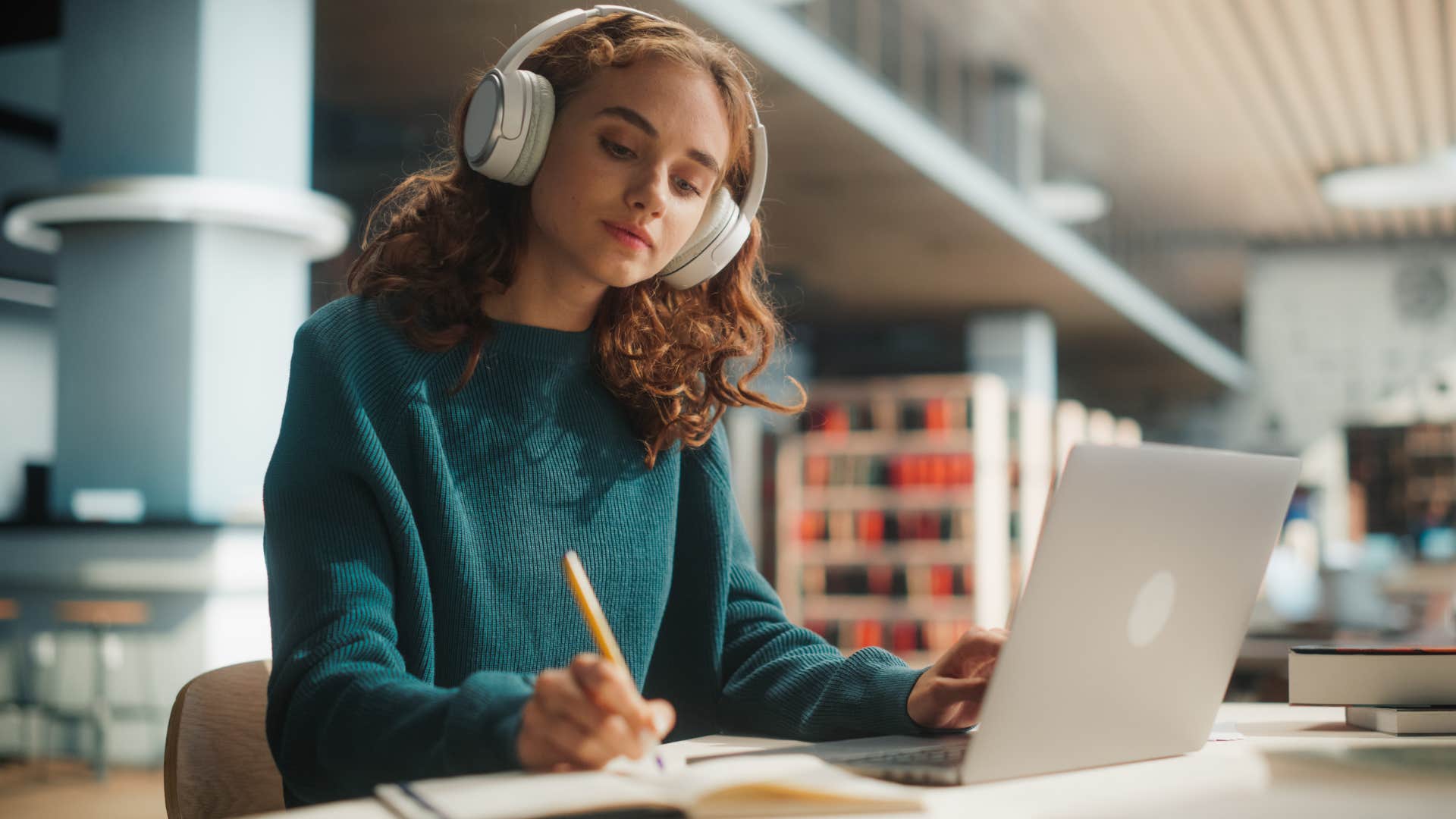 Woman studying in the library.