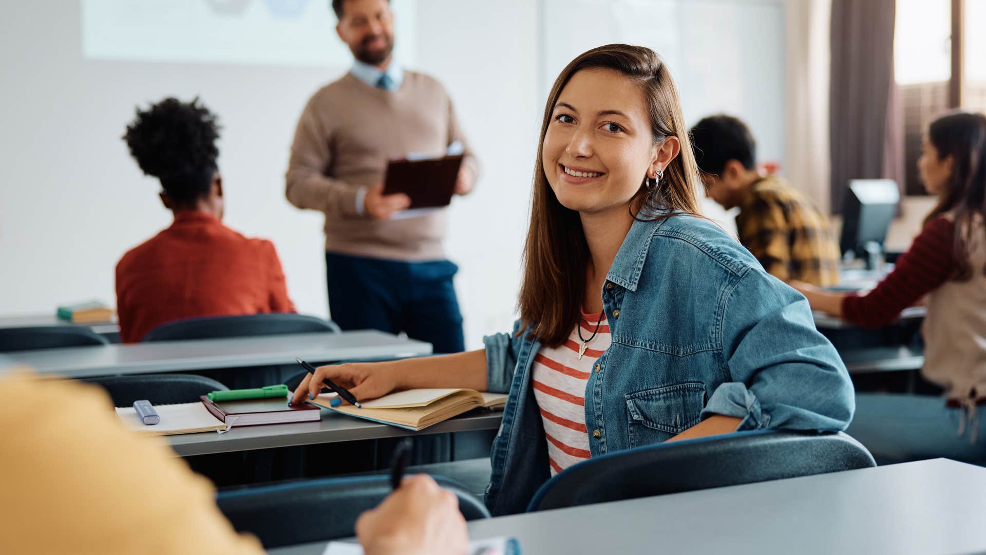 Young student smiling in the classroom.