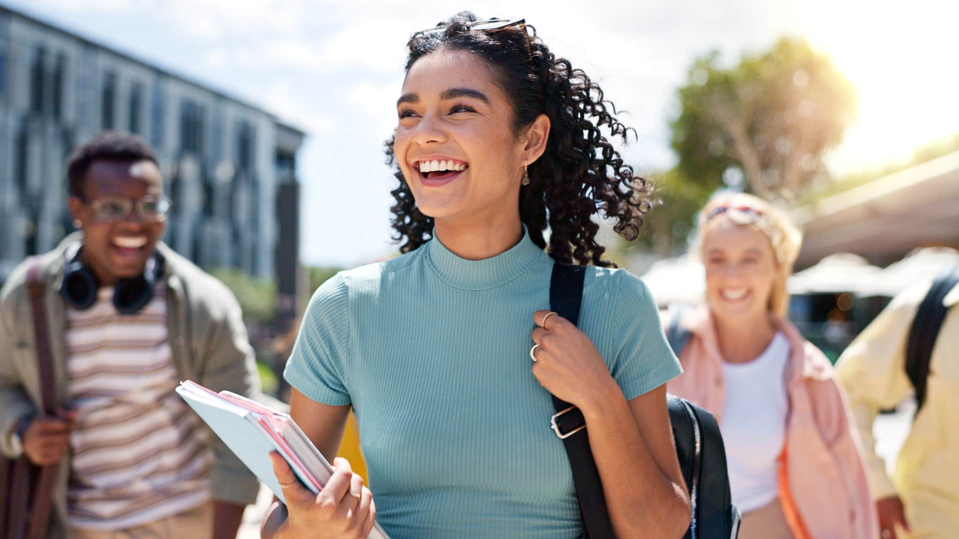 Woman smiling in front of her friends.