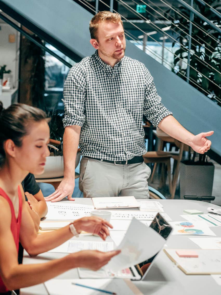 boss standing and talking during meeting