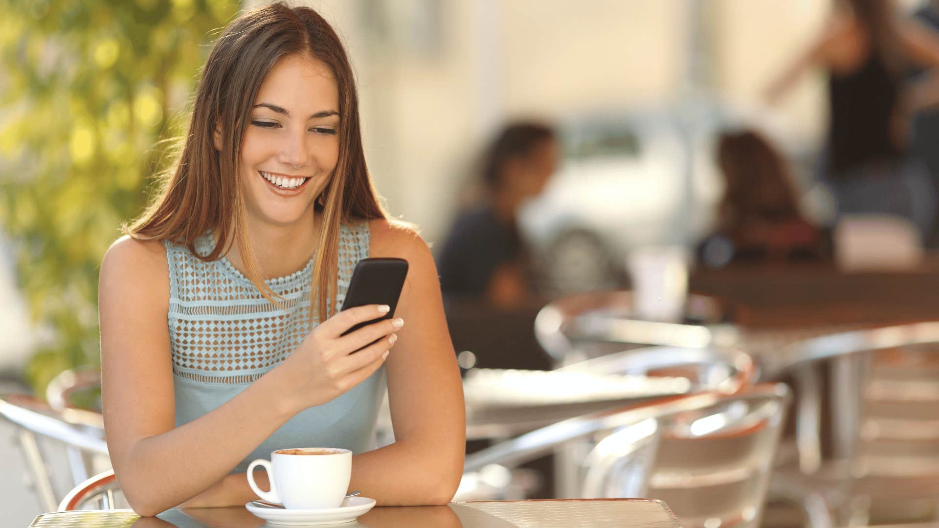 woman typing on her phone