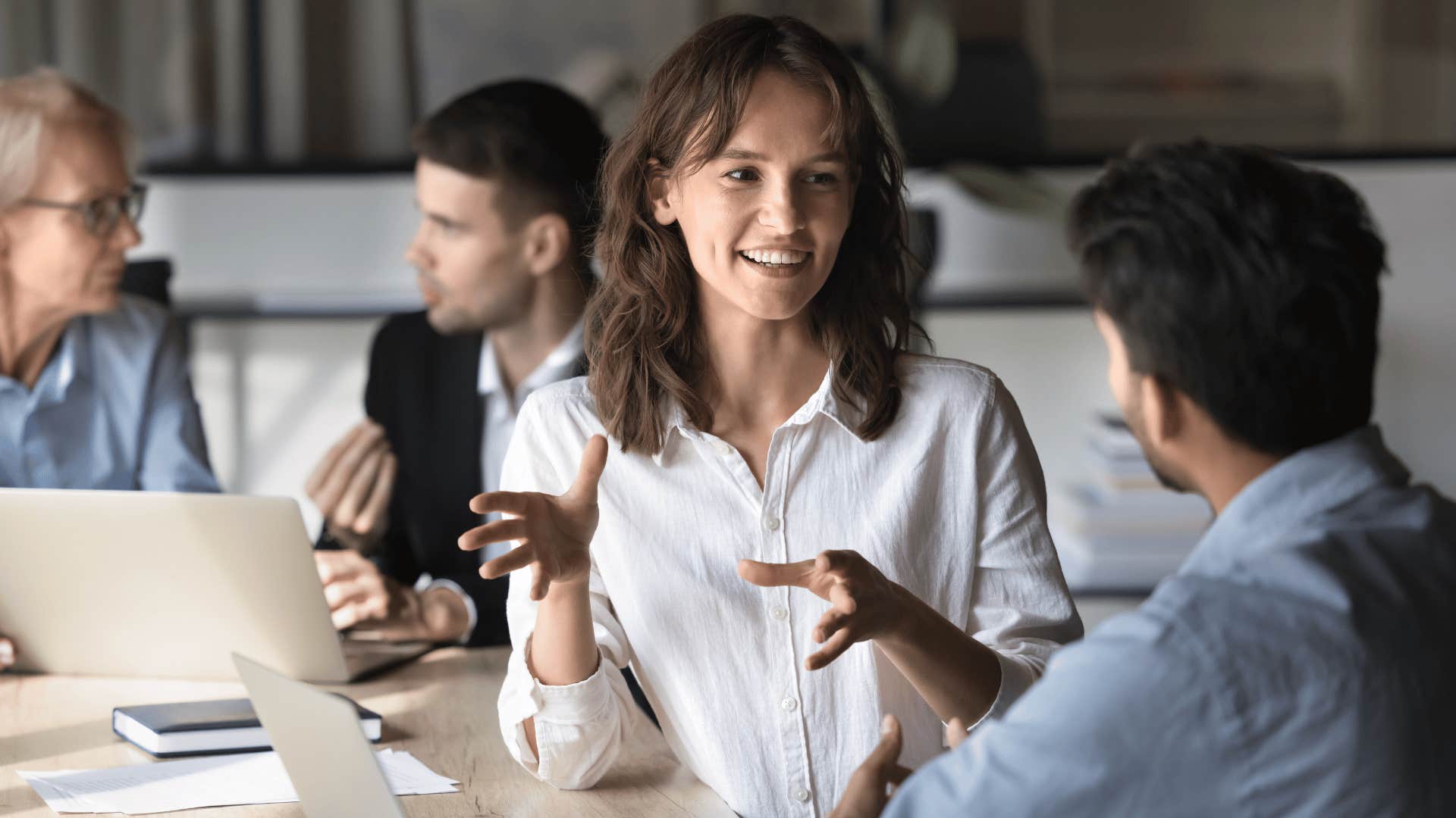 woman talking to male coworker