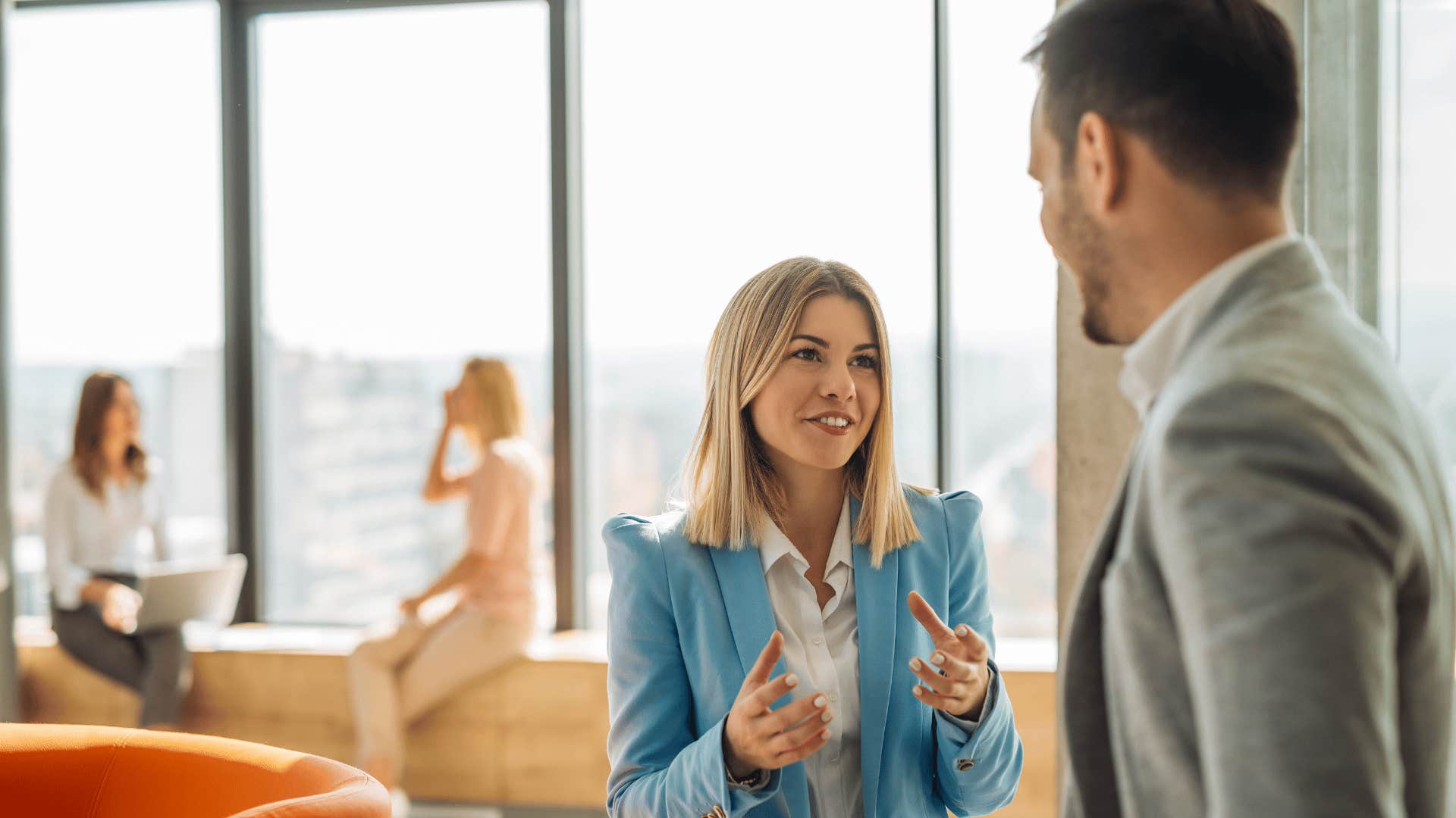 male and female coworker talking