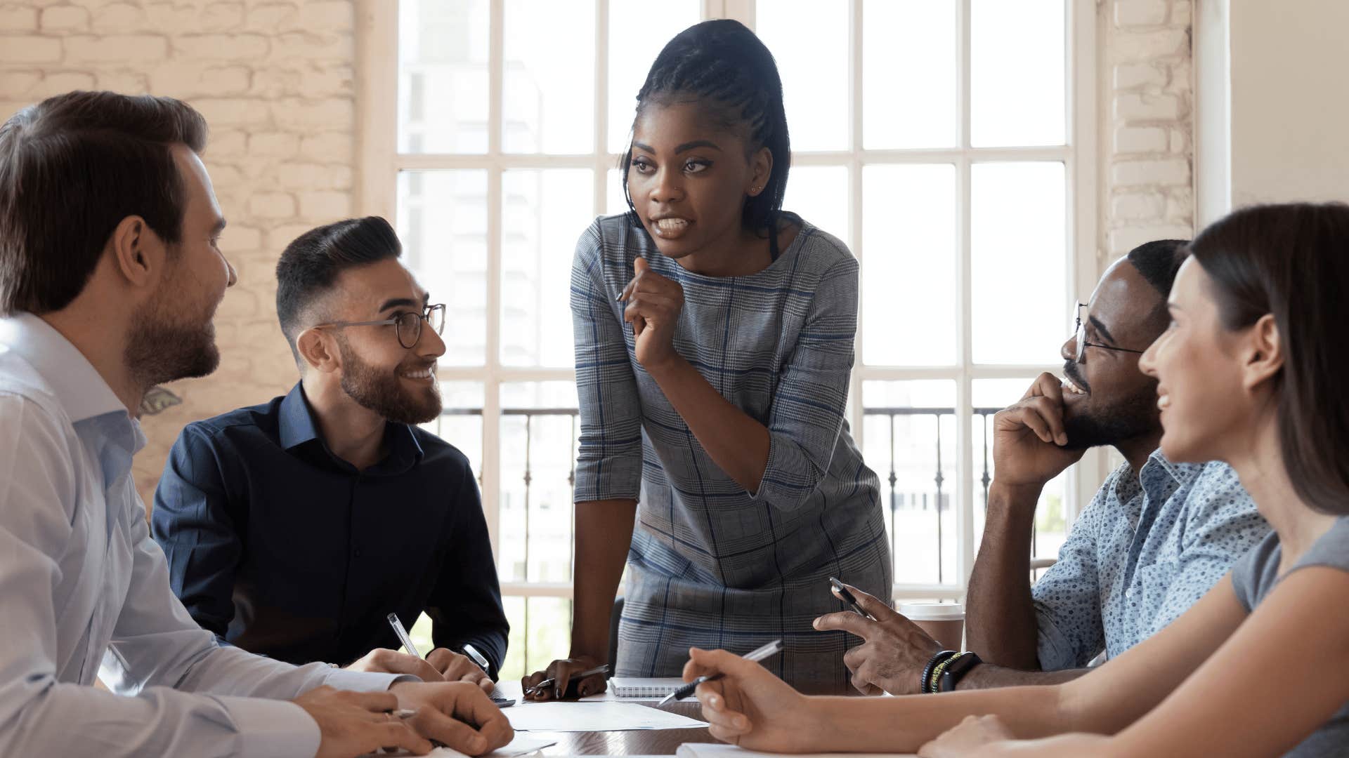 coworkers in a meeting discussing a topic