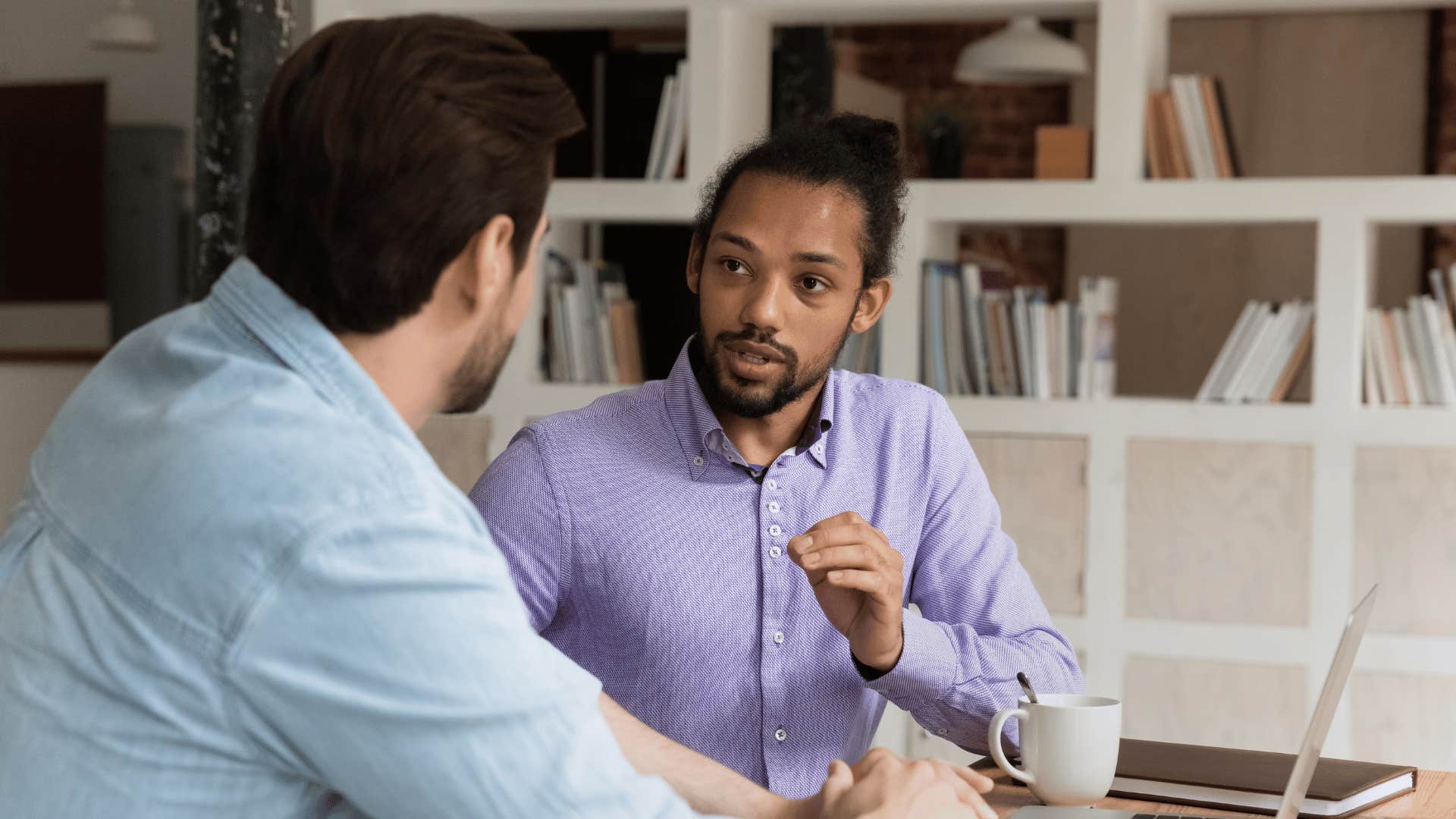 two coworkers talking