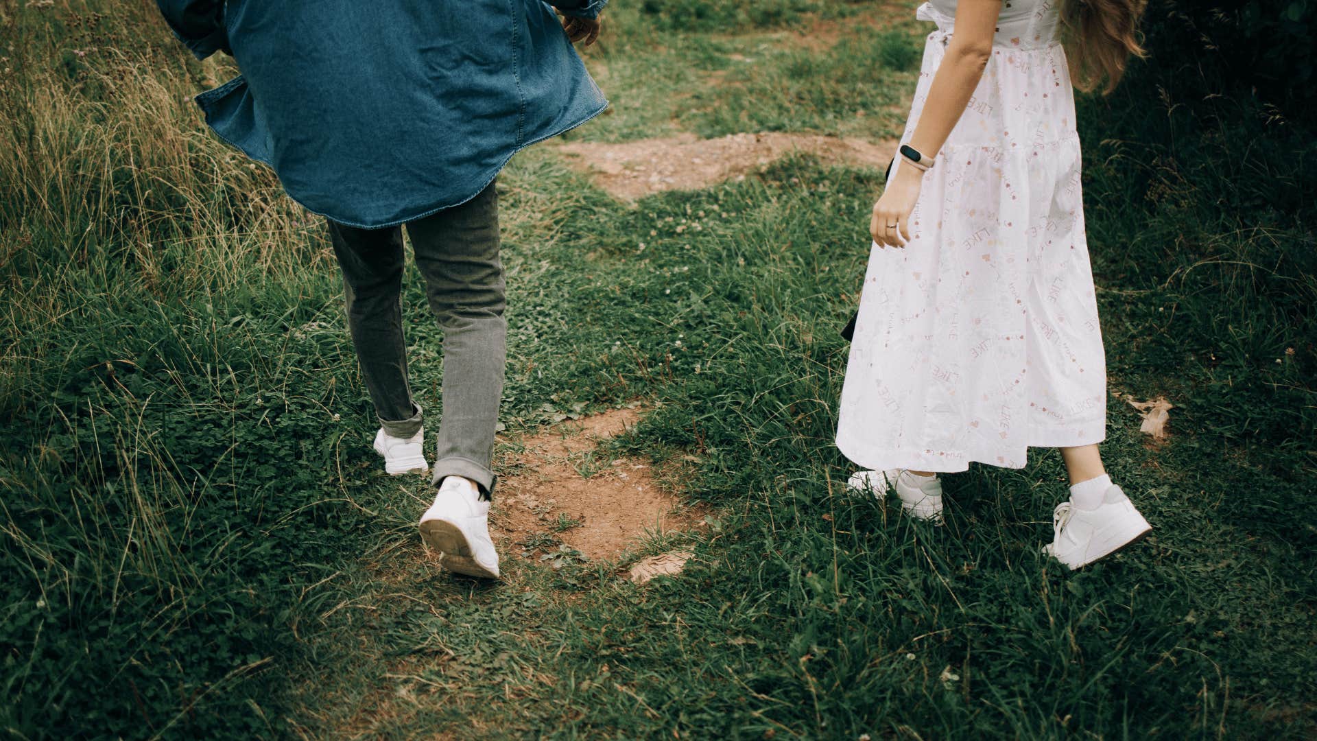 couple walking down path