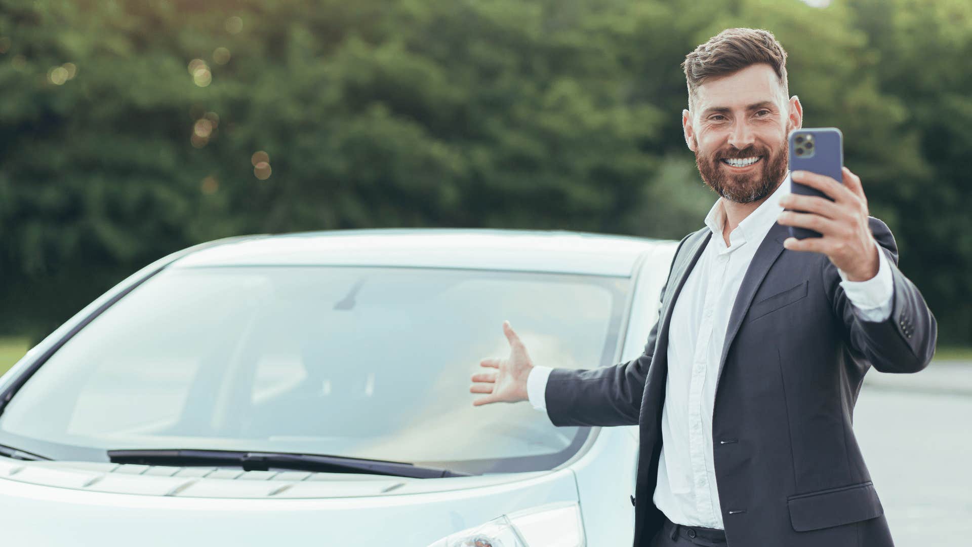 man showing off expensive car