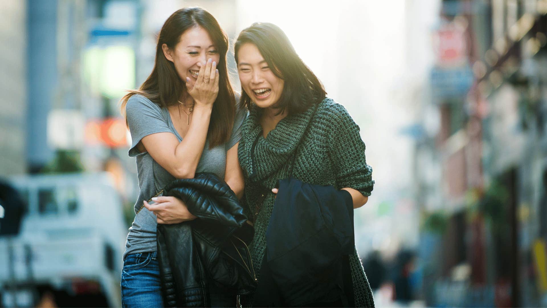 two women chatting while walking 