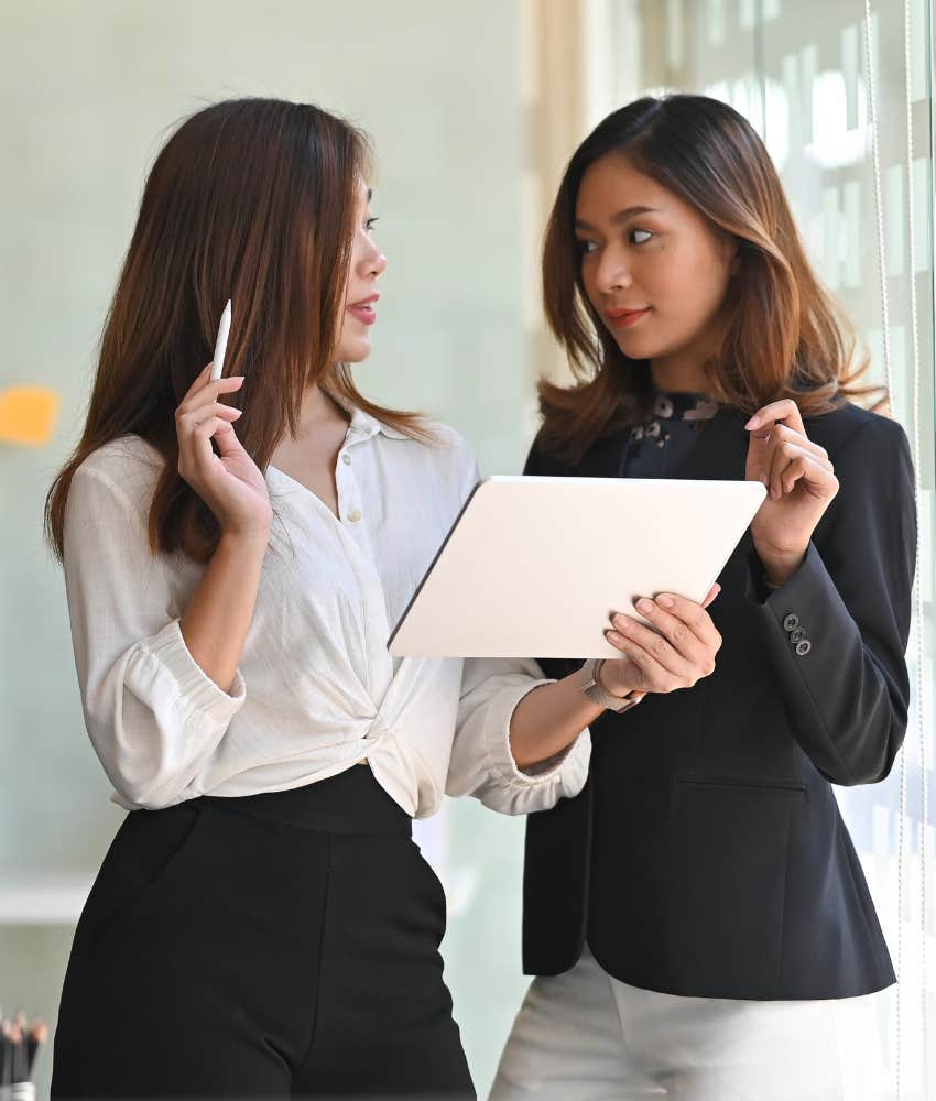 co-workers talking in office