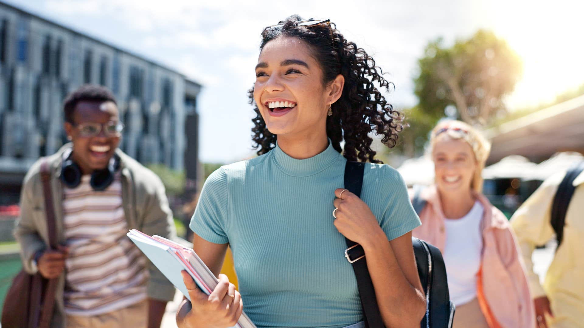 Gen Z woman smiling in front of her friends