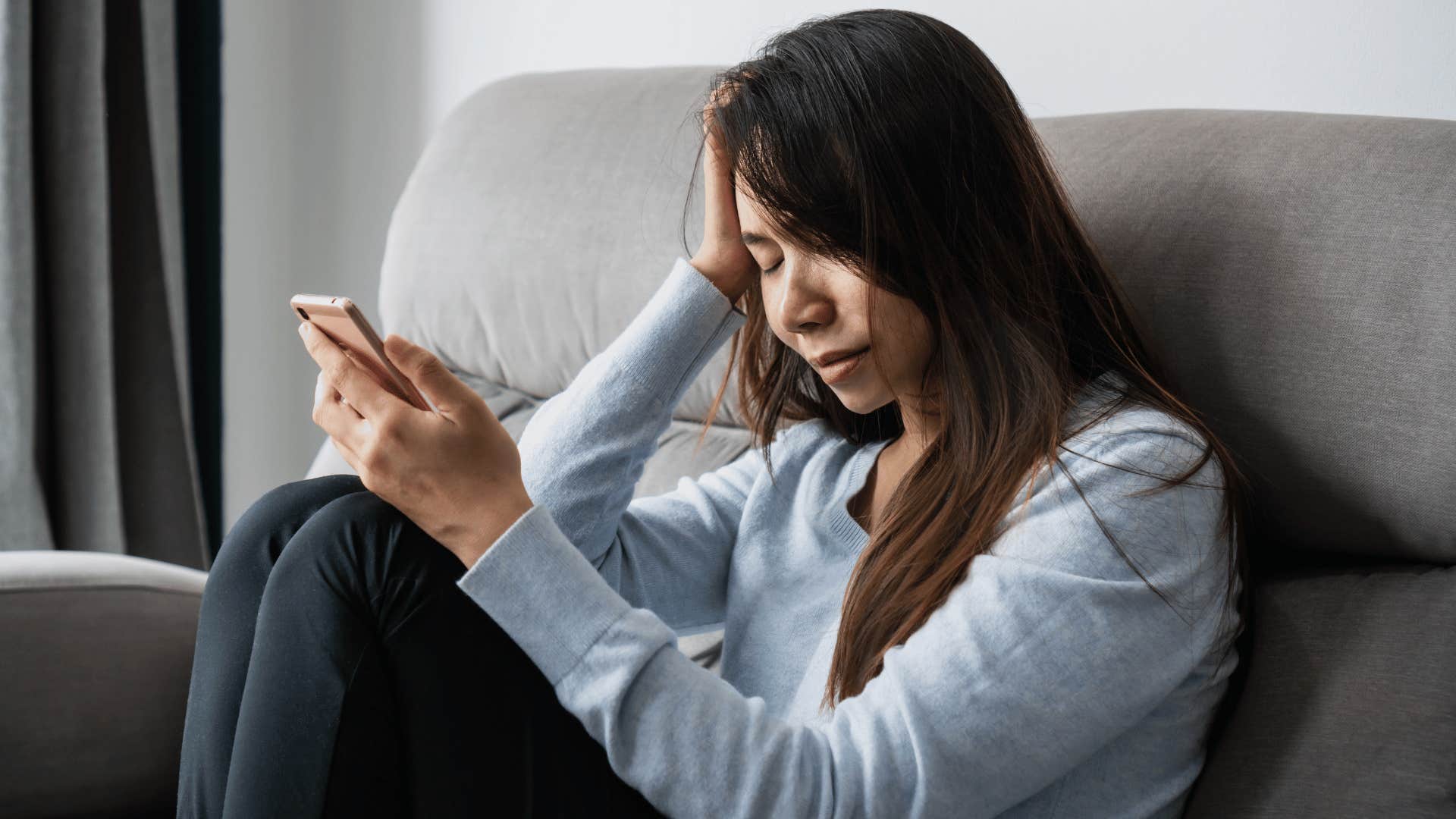 woman looking at her phone