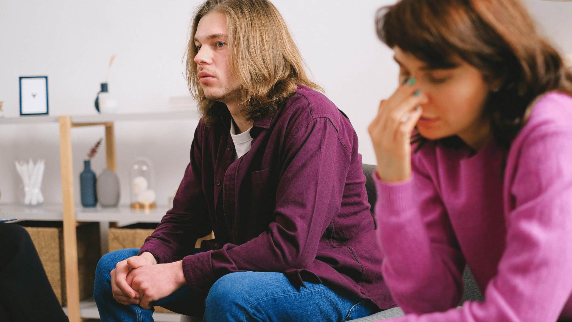 woman frustrated sitting next to man