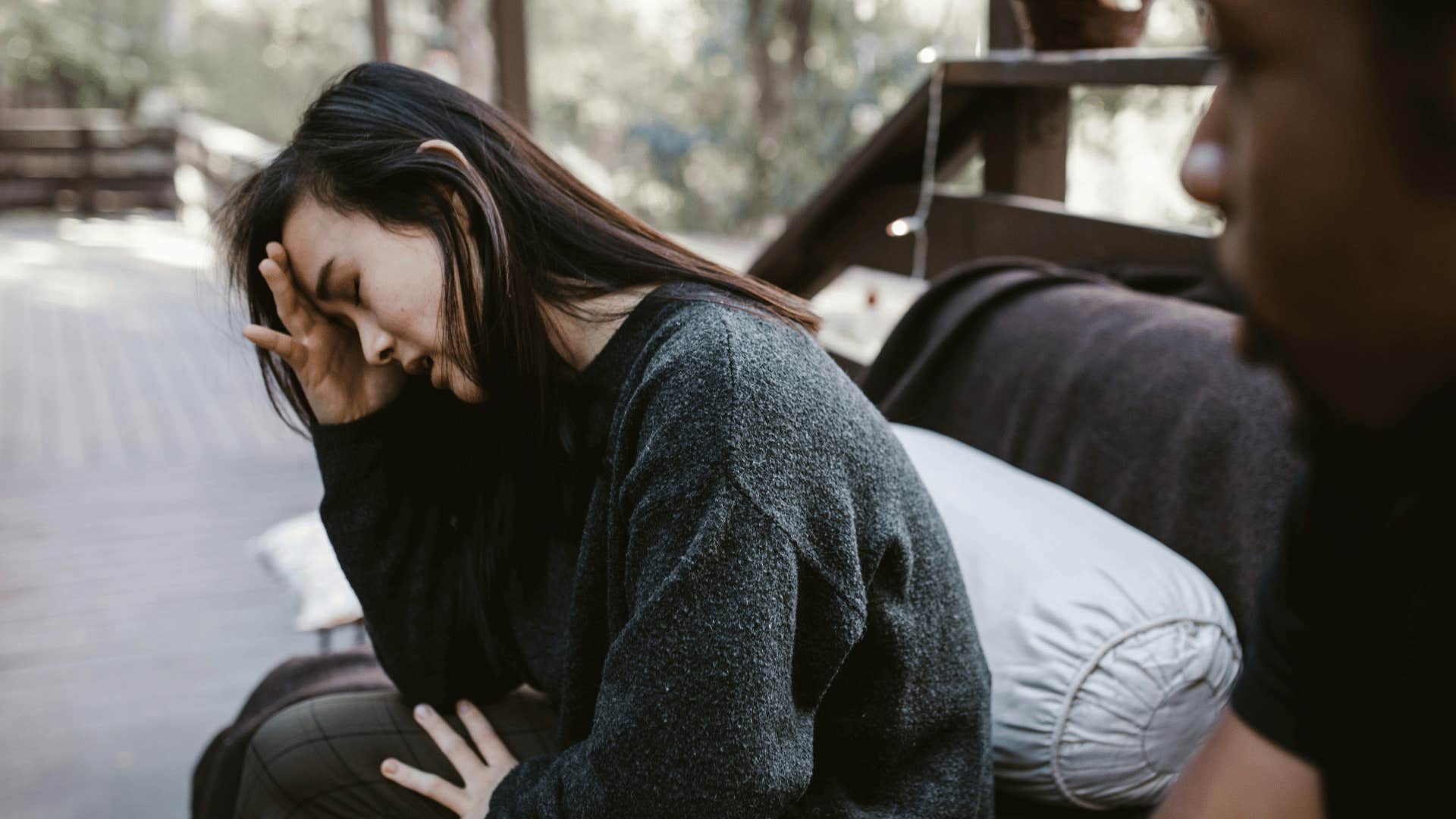 woman crying while talking to man