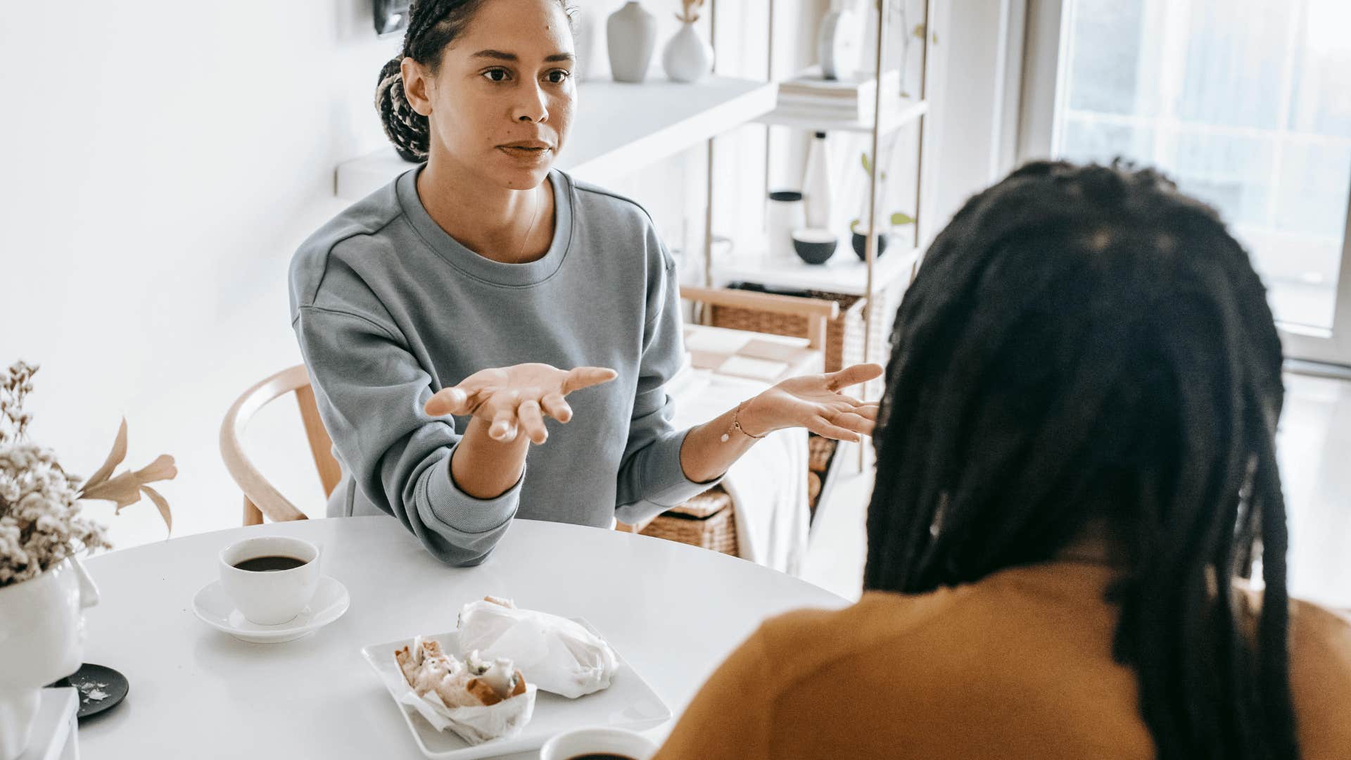 woman and man arguing at table