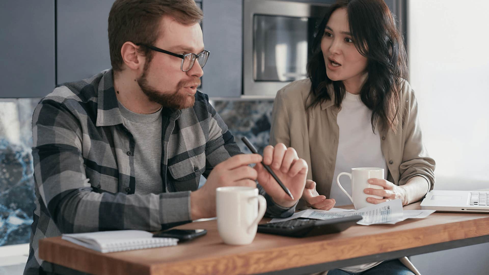 couple talking at kitchen table