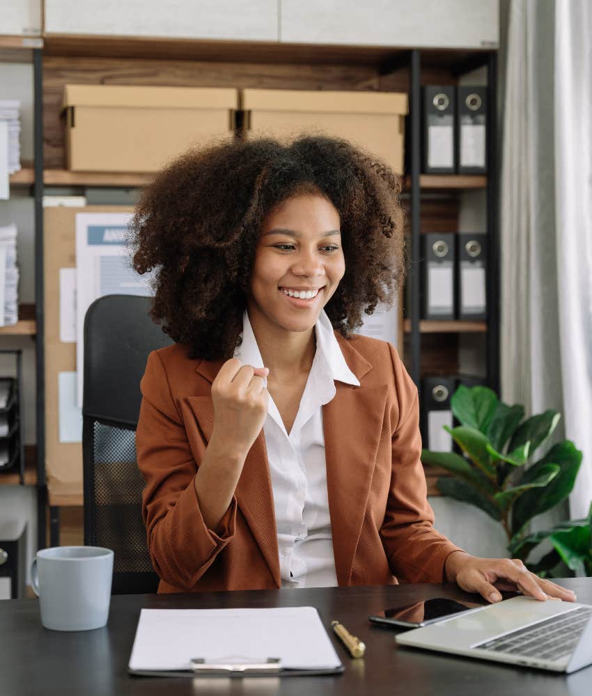 Female employee celebrating her success