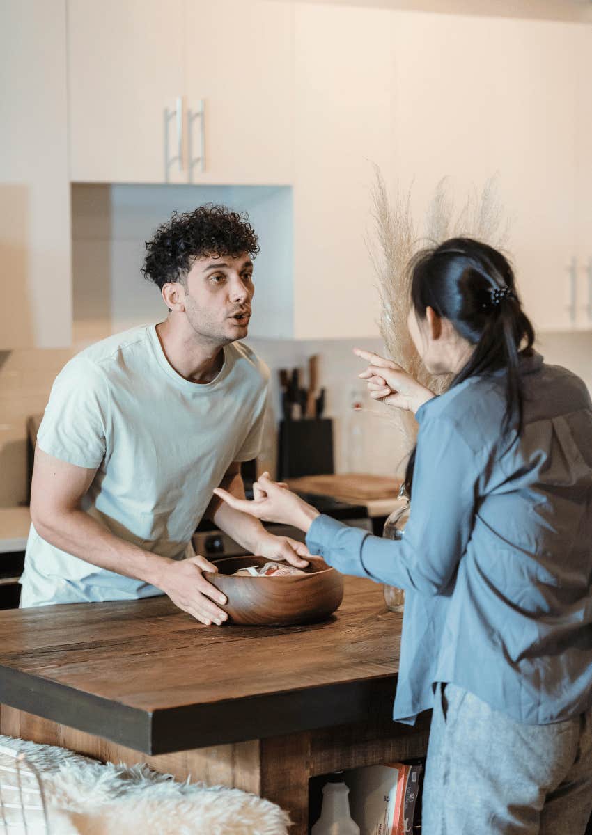 couple arguing across a table