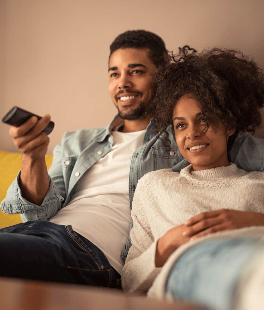 Couple with remote control watch movie