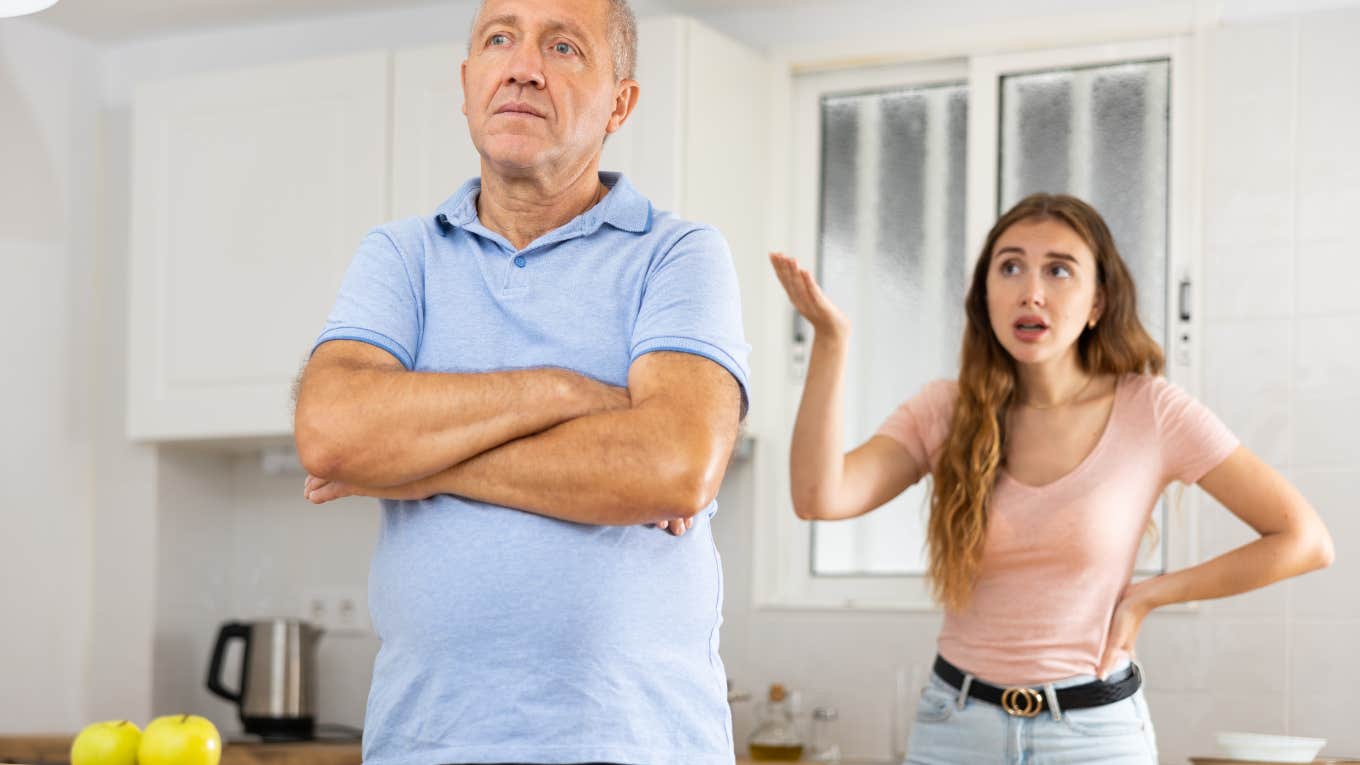 daughter and father arguing in kitchen