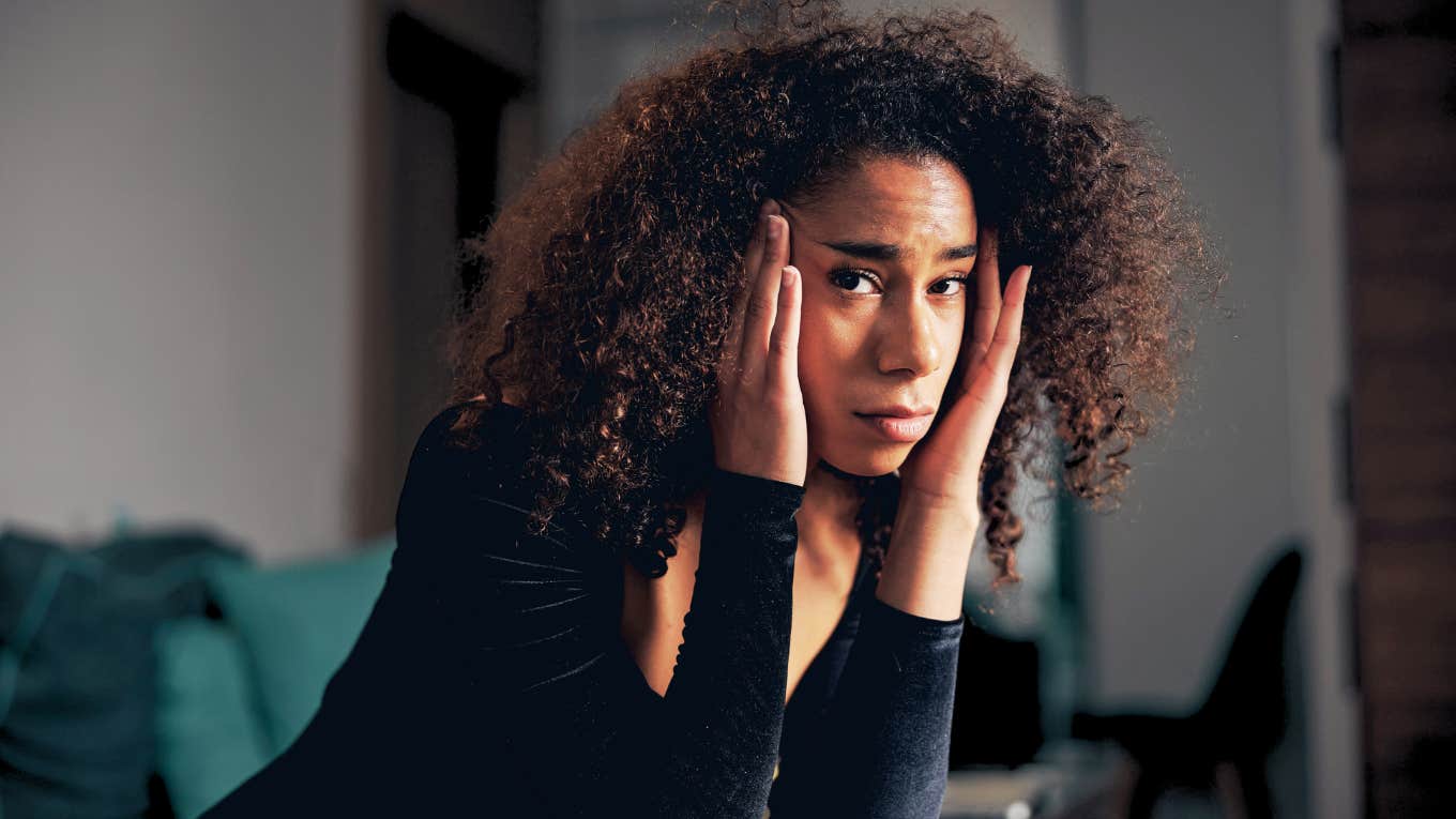 Depressed woman looking up.