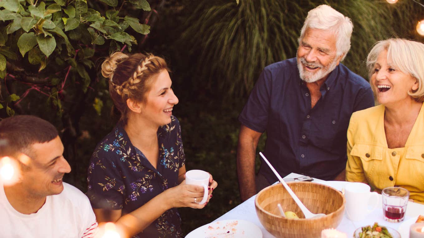 Woman enjoying time with her husband's family.