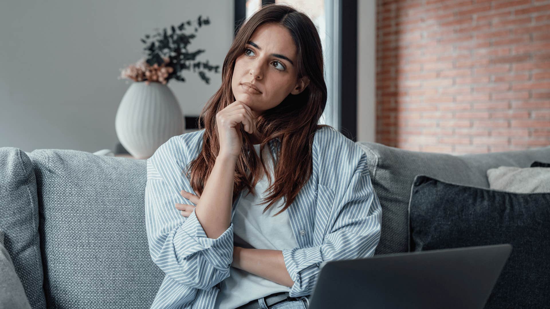 woman thinking while working 