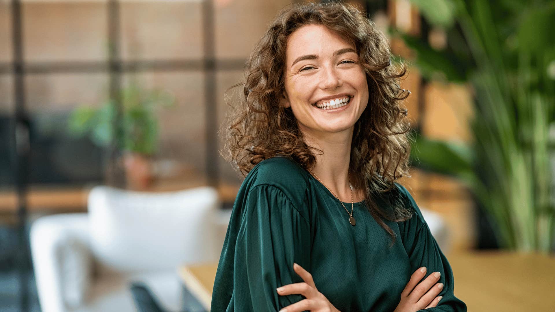 woman smiling and crossing arms 