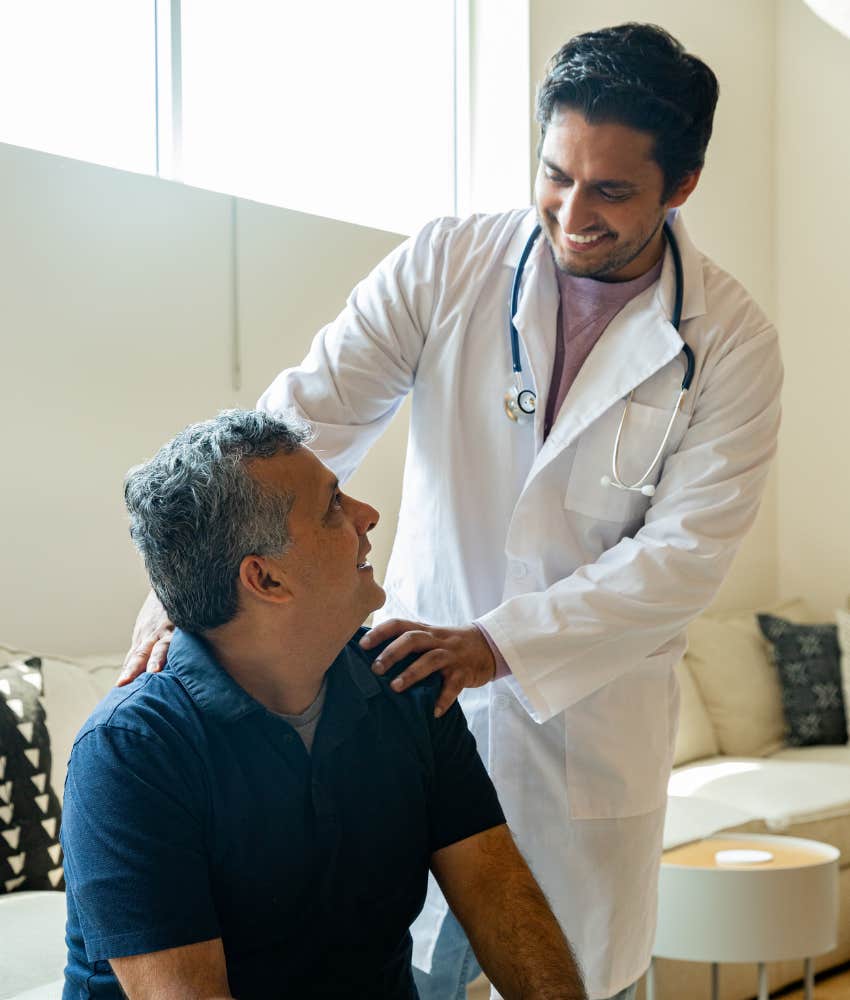 Doctor treating patient in office