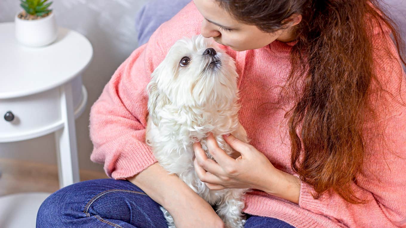 Dog sitter kissing dog she wants to keep