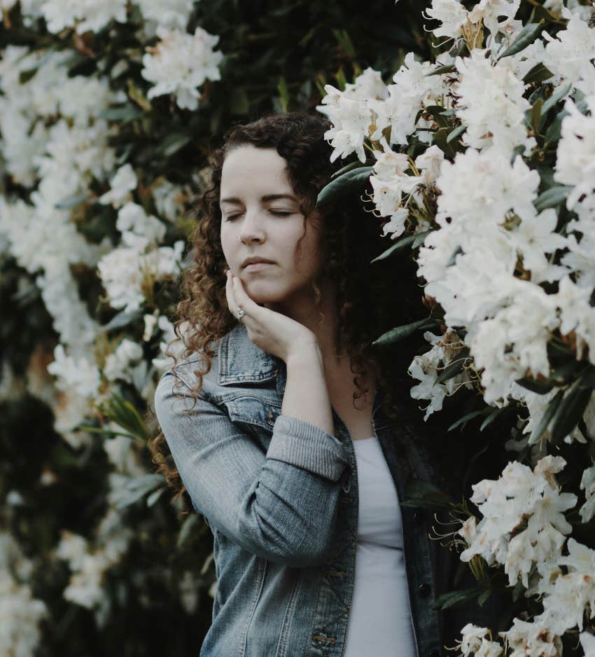 woman with closed eyes meditating to transform life