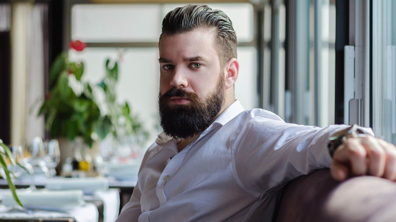 Elder millennial man sitting in a restaurant