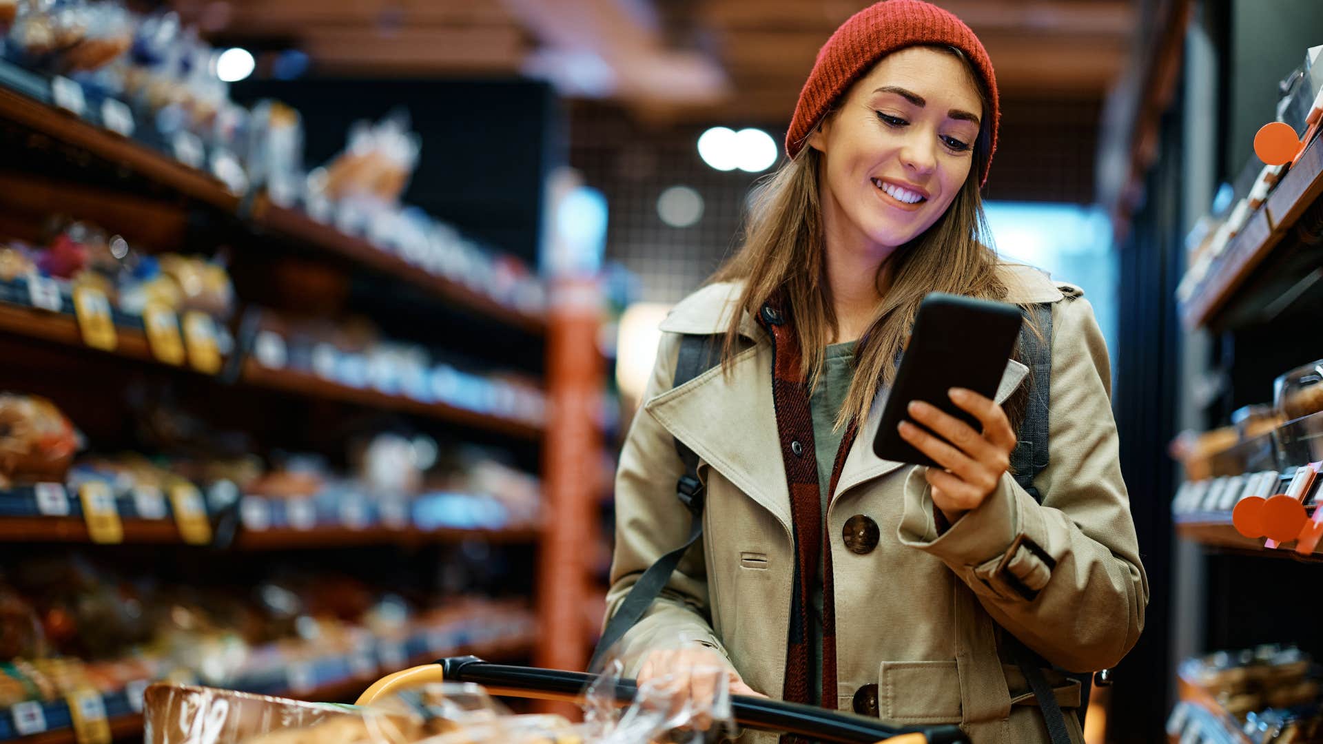 Woman smiling while shopping in a grocery store