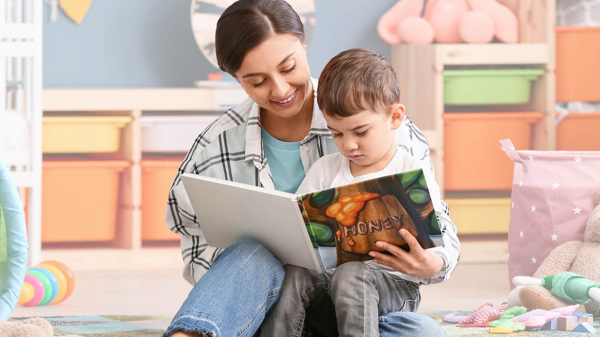 Babysitter reading to a young boy