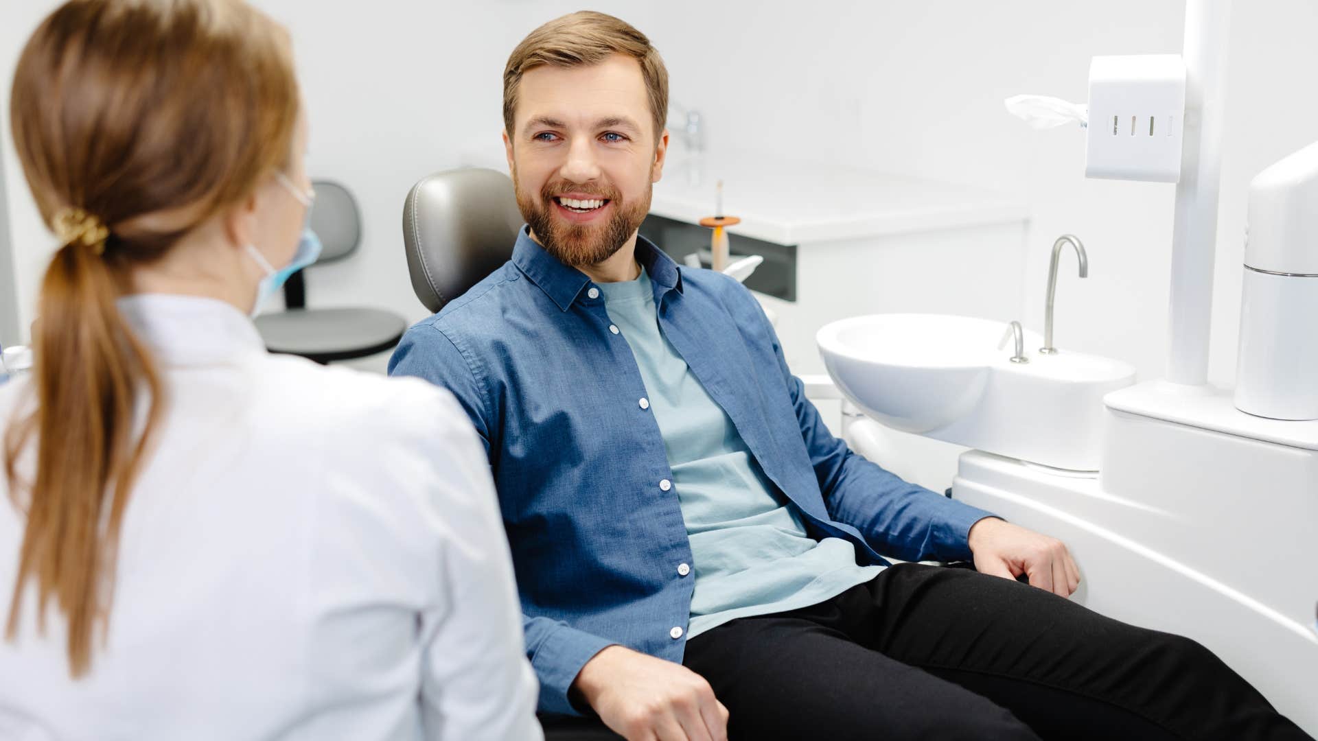 Young man sitting in a dentist chair