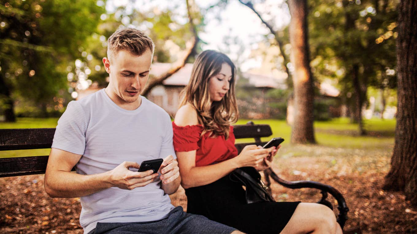 Couple ignoring each other, on their phones.