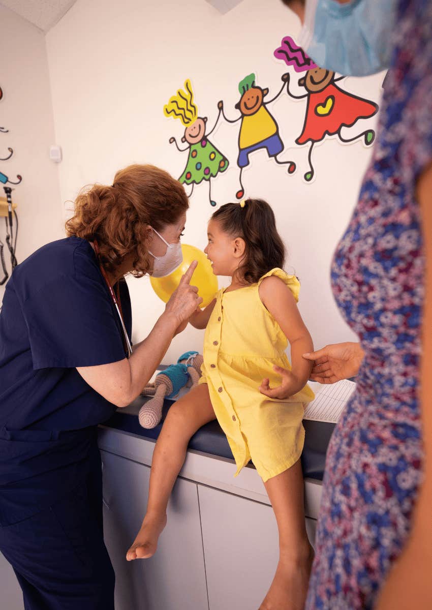 female doctor caring for young girl