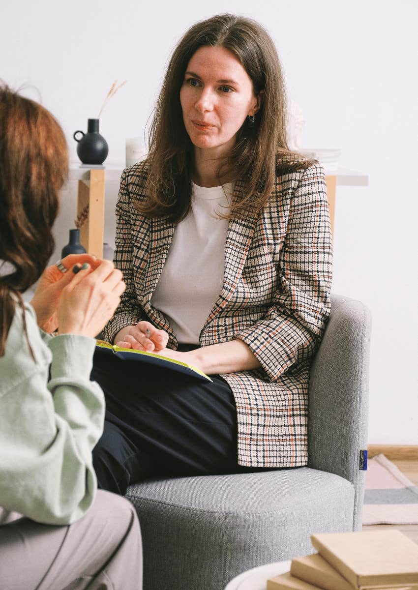 female therapist listening intently to client