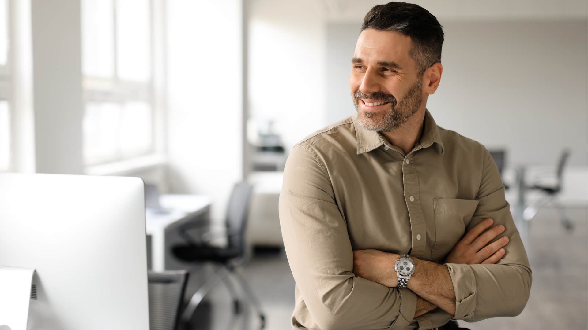 Professional man smiling in the office.