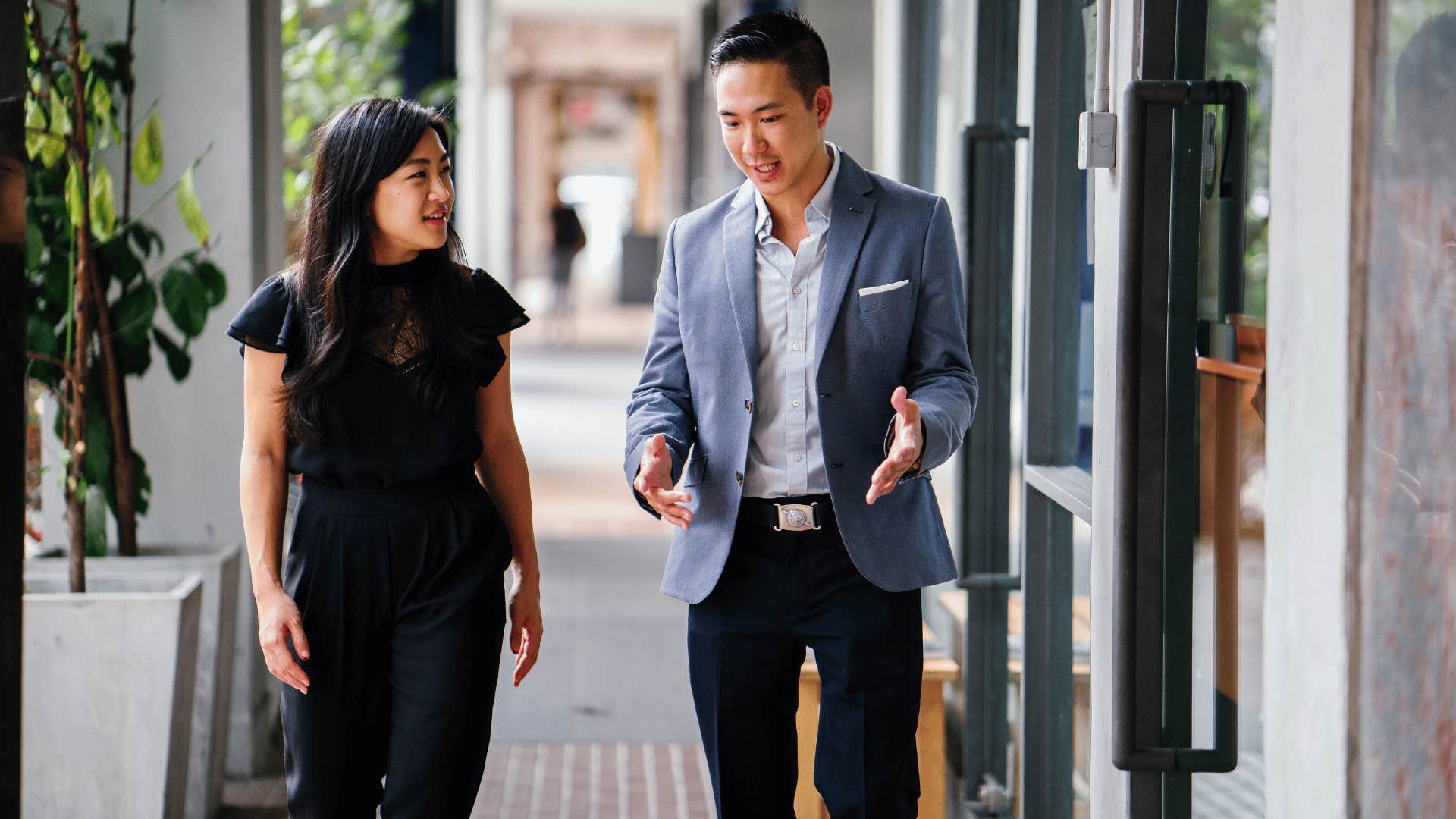 man and woman walking side by side 