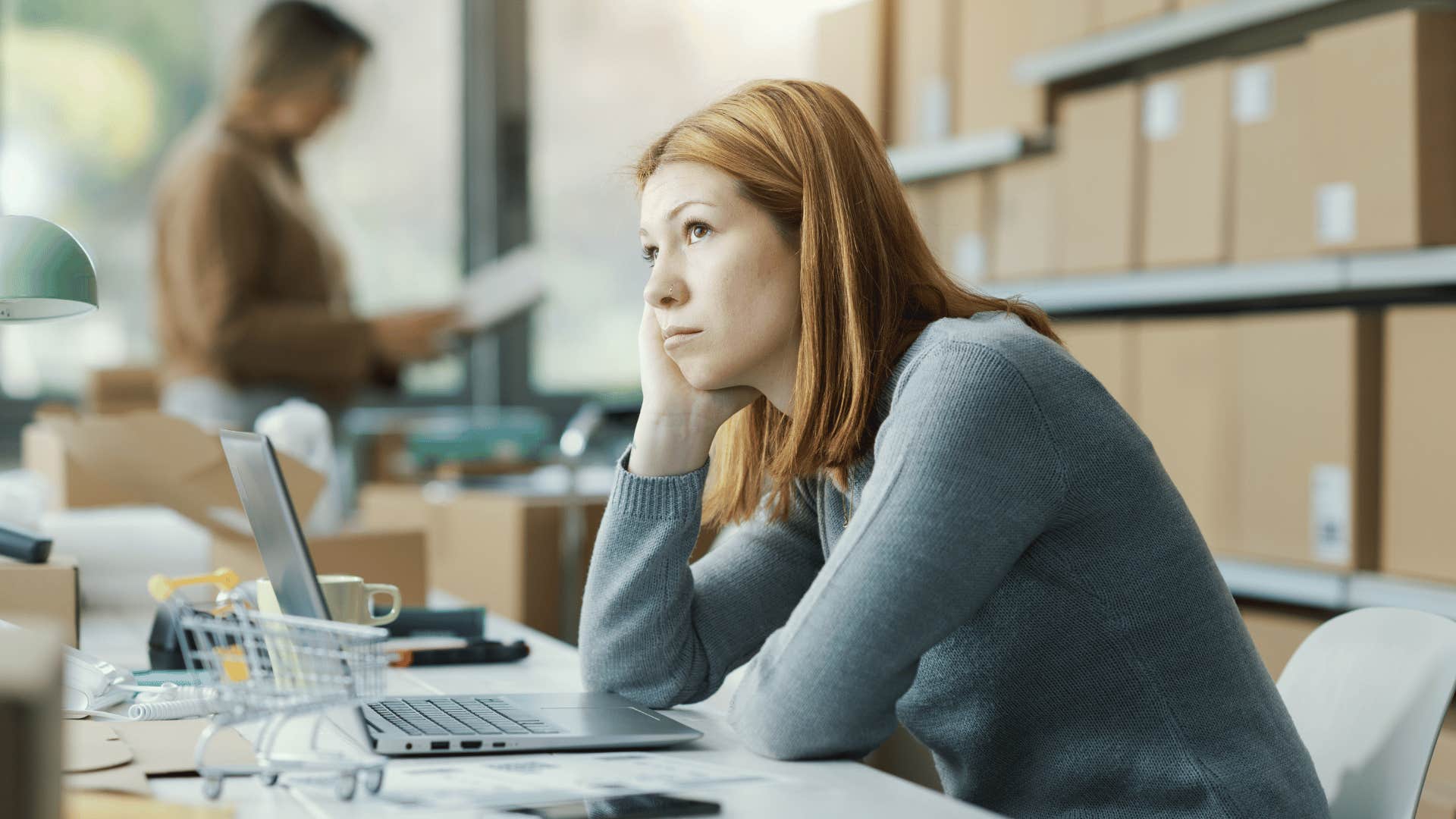 woman staring up and looking bored 