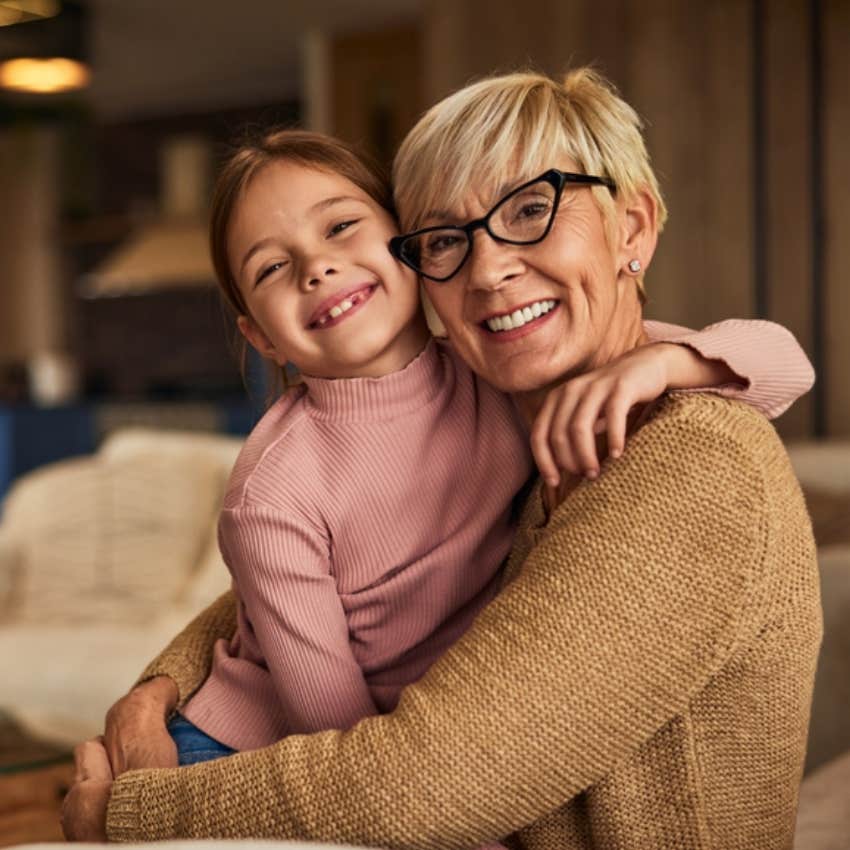 granddaughter hugging grandma