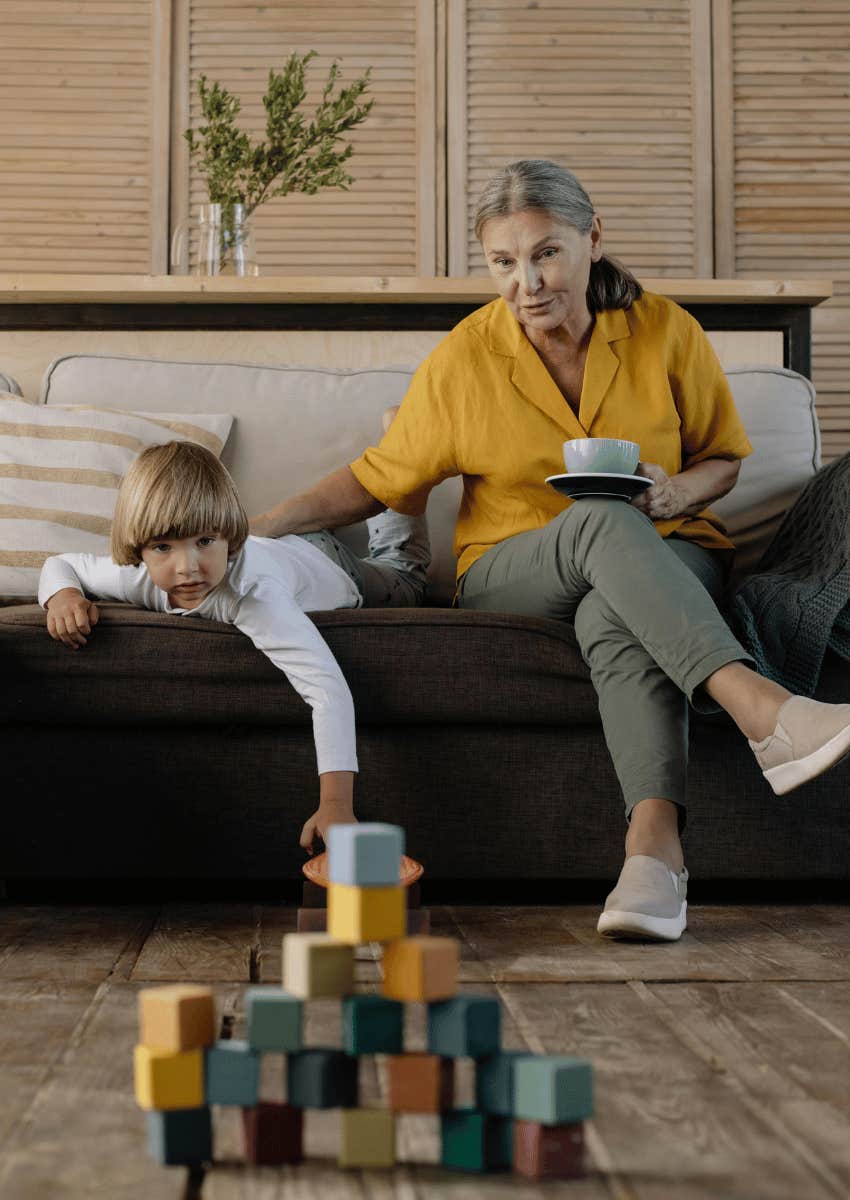 grandmother with a young boy playing