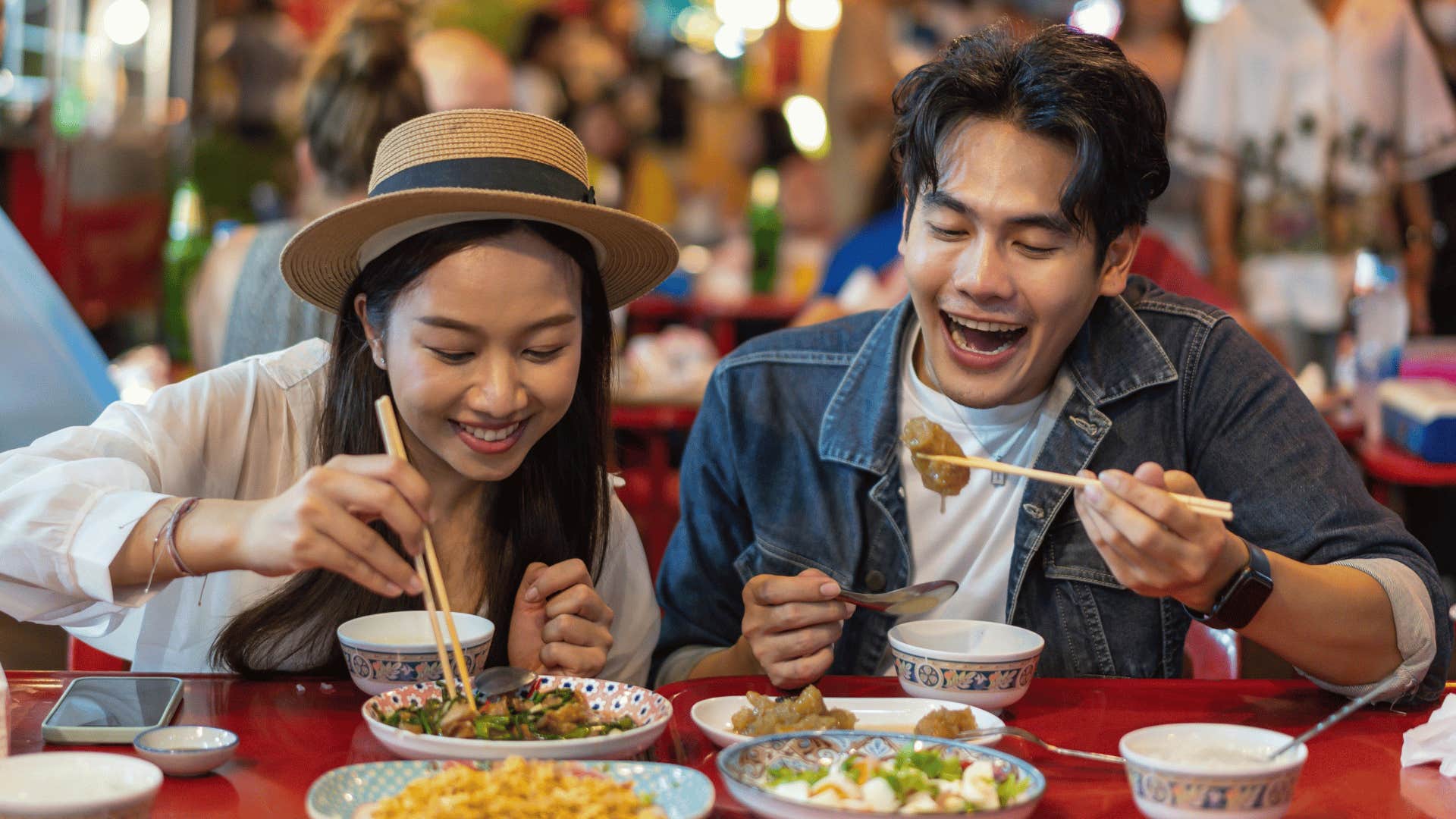 man and woman eating together 