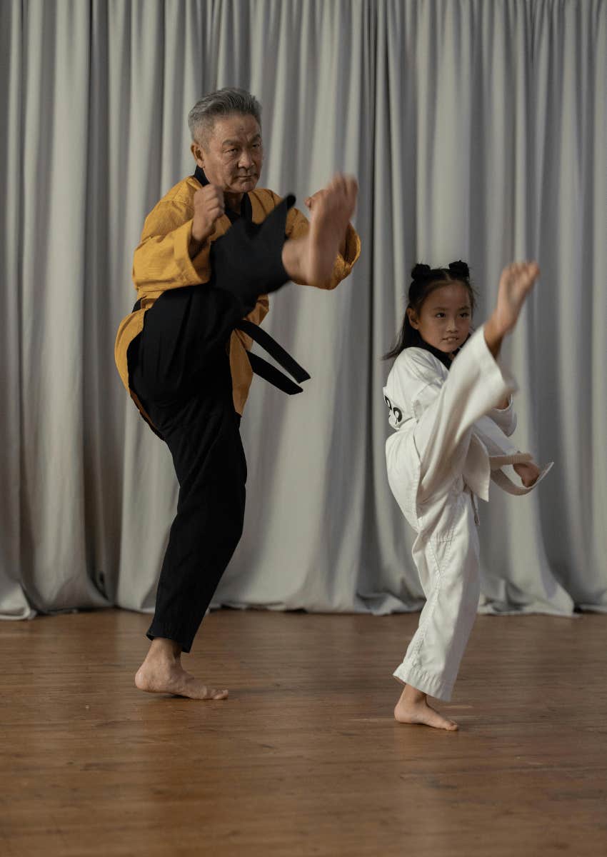 instructor and young girl doing a karate demonstration